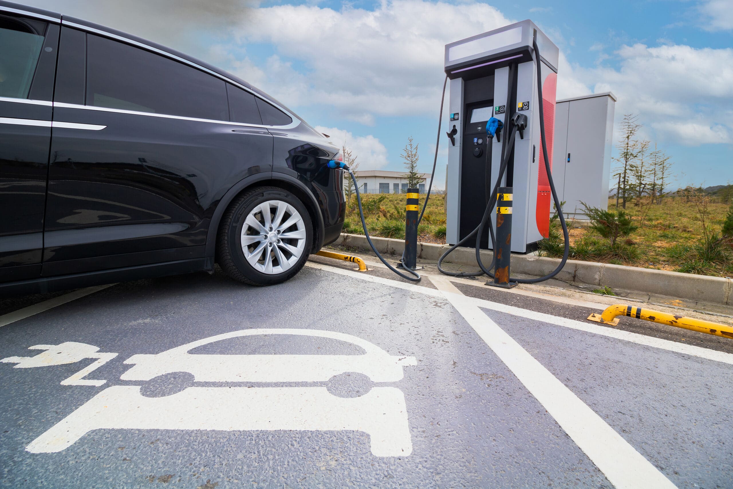 Ev Car Plugged In Charger And Ev Charger Station. Electric Car C